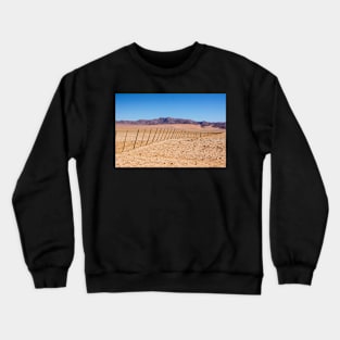 Fence across the desert. Crewneck Sweatshirt